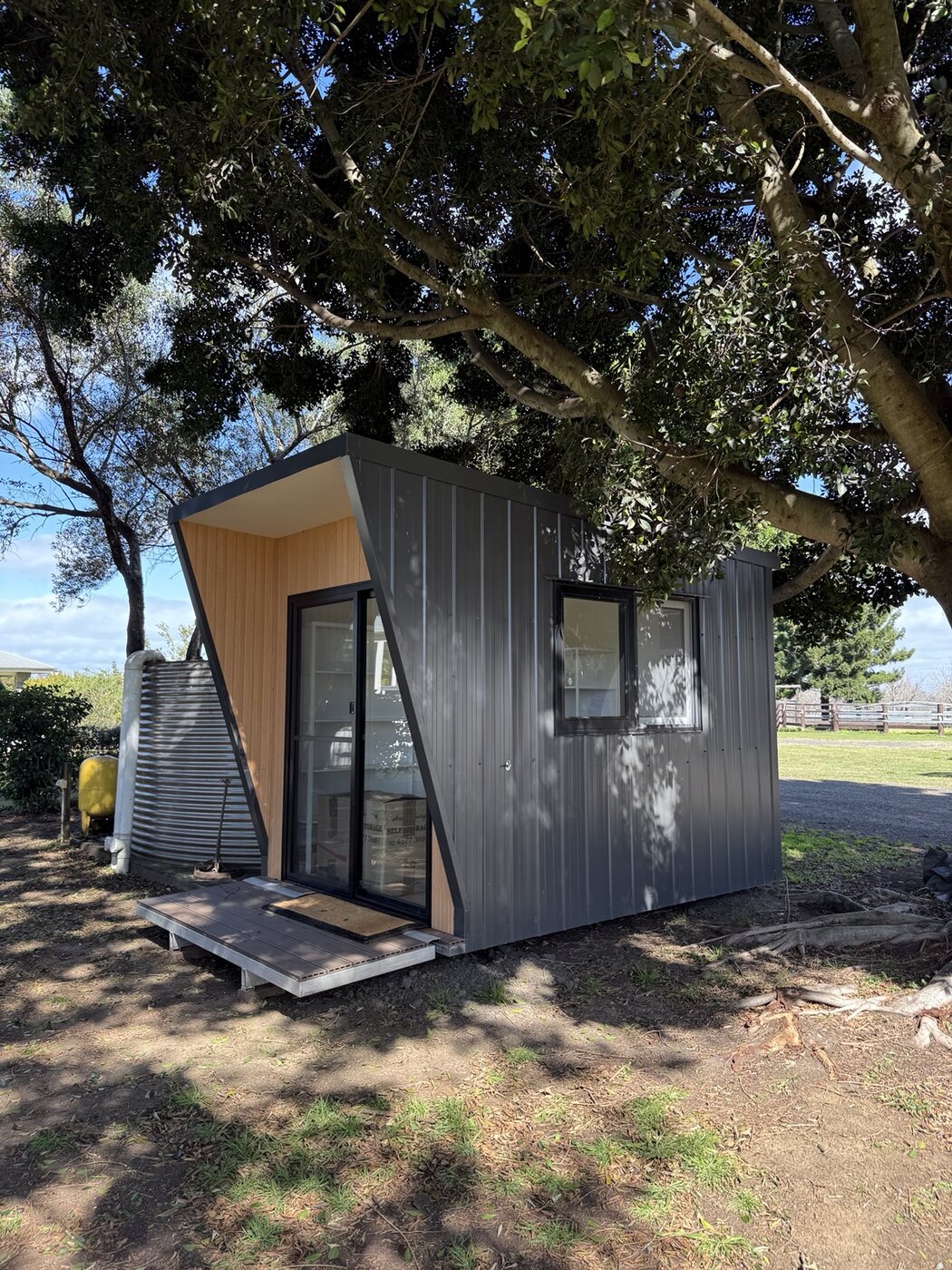 Portable pod beneath established trees